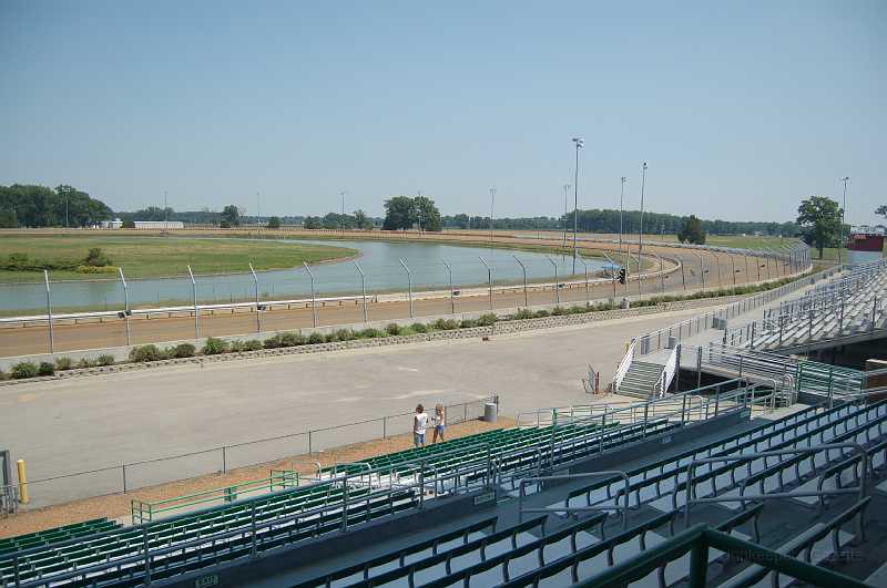 DuQuoin 2006 019.JPG - Turns 1 & 2 of the track.  For perspective, there is a bike & rider entering turn 1; can you see him?  A mile track is HUGE!  ... and blazing FAST!  YeeHaa!!